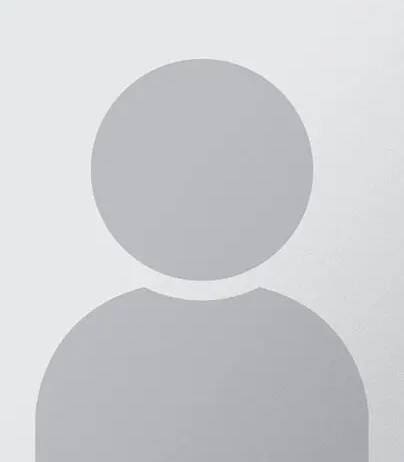 A person with a white circle on their head.
